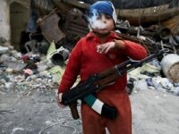  8-year-old Ahmed with cigarette and gun – the most shocking image from Syrian war