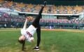 Rhythmic gymnast throws amazing pitch at baseball game