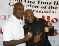 Former nemeses Mike Tyson, Evander Holyfield meet again in friendly reunion