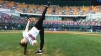 Rhythmic gymnast throws amazing pitch at baseball game